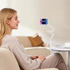 White minimalist ABS flexible gooseneck phone holder clamped to a table, used hands-free.